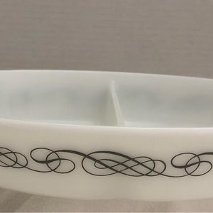 Pyrex white divided serving dish with black scroll print.